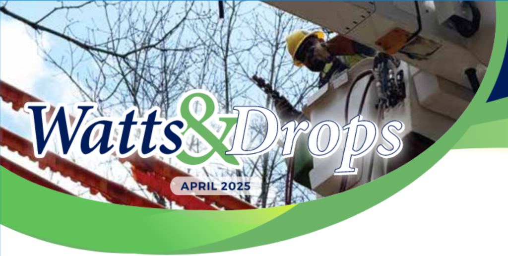 Utility worker wearing a yellow hard hat operates from a bucket truck near power lines, with a Watts & Drops April 2025 banner.