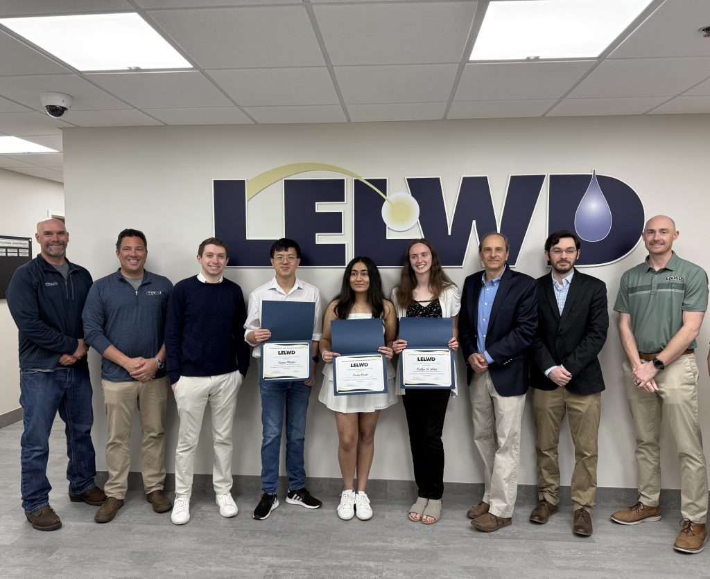 Pagacik Scholarship winners pose with certificates in front of the LELWD logo.